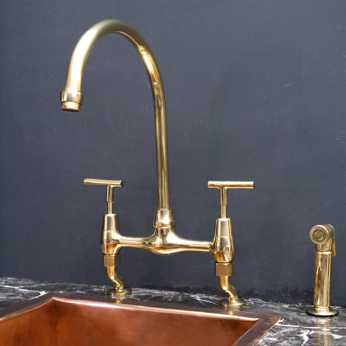 Unlacquered Brass Curved-Leg Bridge Kitchen Faucet – Two-Handle Design – detail of curved legs