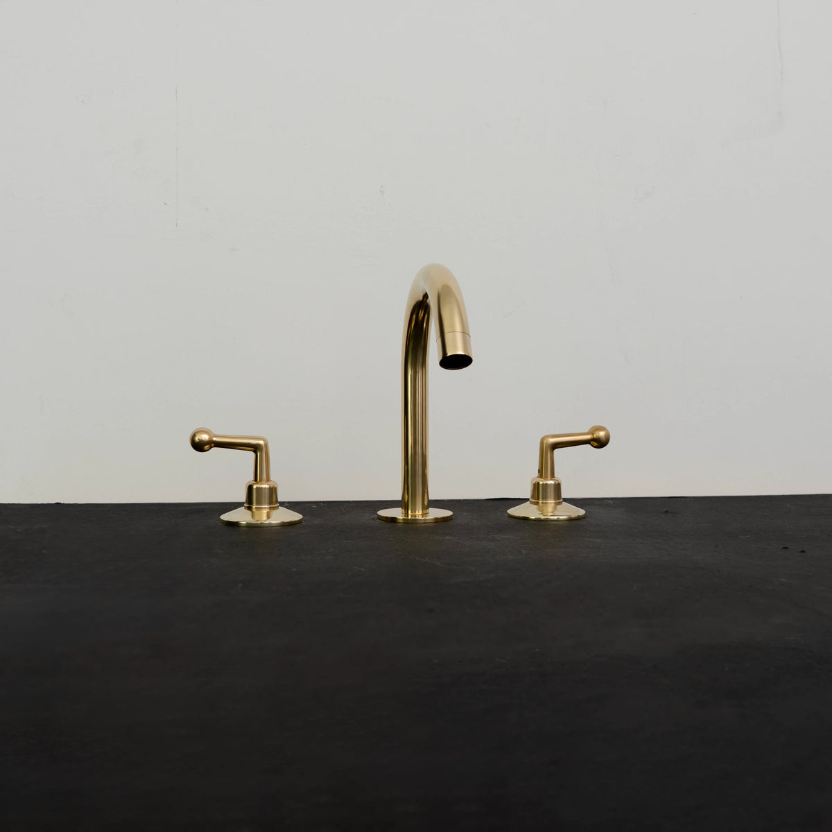 Golden Arch Bathroom Faucet – Modern Brass Gooseneck – installed in bathroom setting