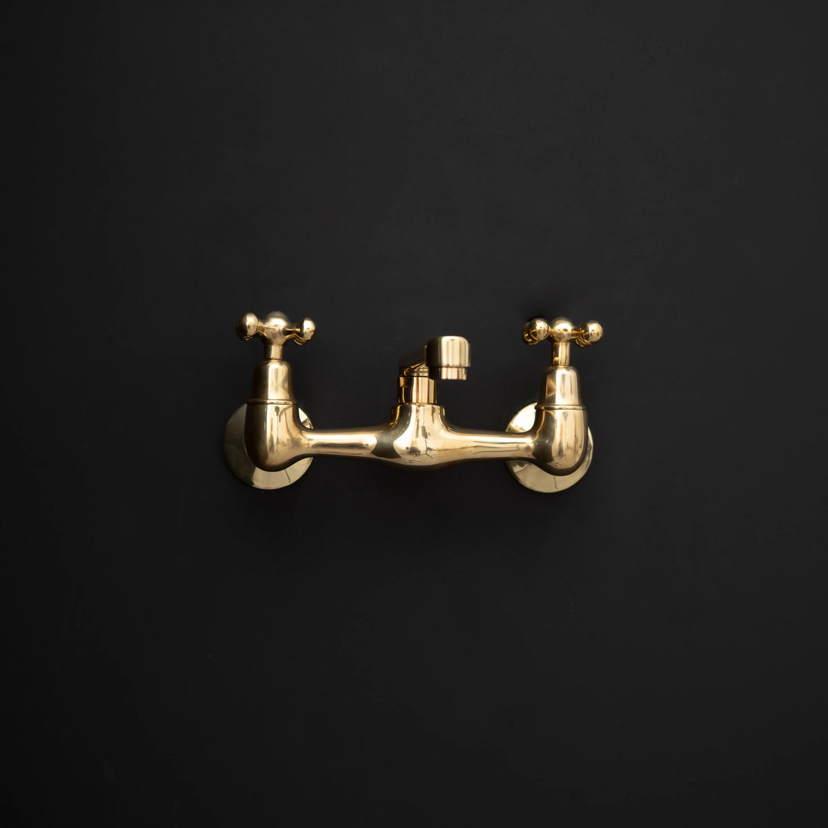 Artisan Wall-Mount Bridge Faucet – Aged Brass, Short Spout – detail of aged brass finish