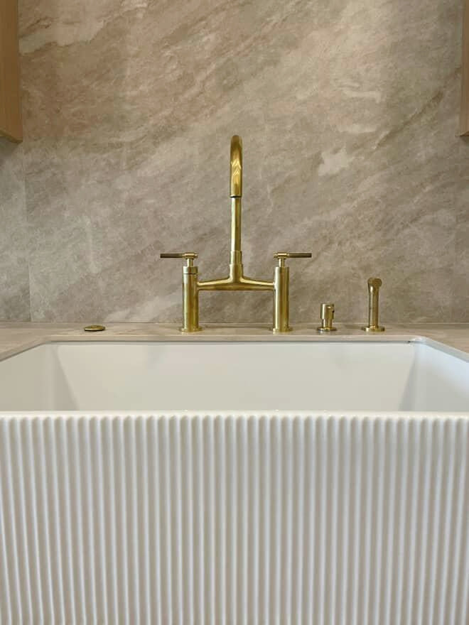 Unlacquered Brass Bridge Faucet with Side Sprayer – detail of handle and finish