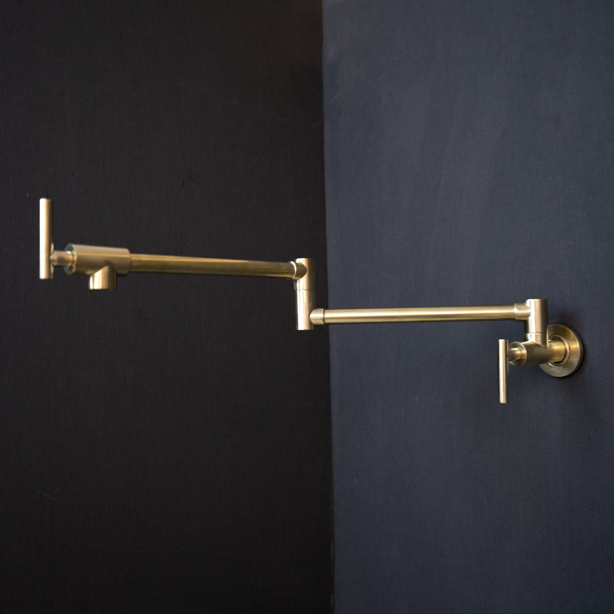 Unlacquered Brass Wall-Mount Pot Filler – Compact Swing Arm – installed above kitchen sink