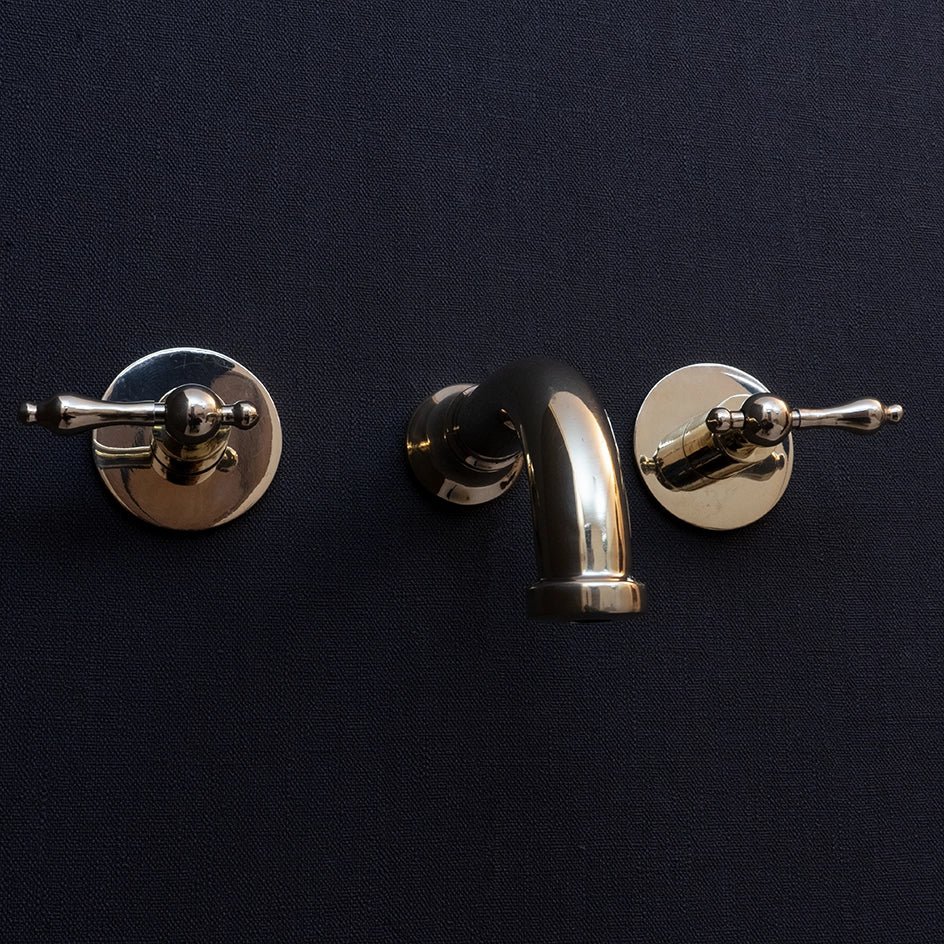 Wall-Mounted Unlacquered Brass Faucet - Lever Handles - close-up detail